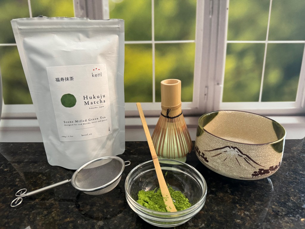 Supplies needed to make a matcha latte.
